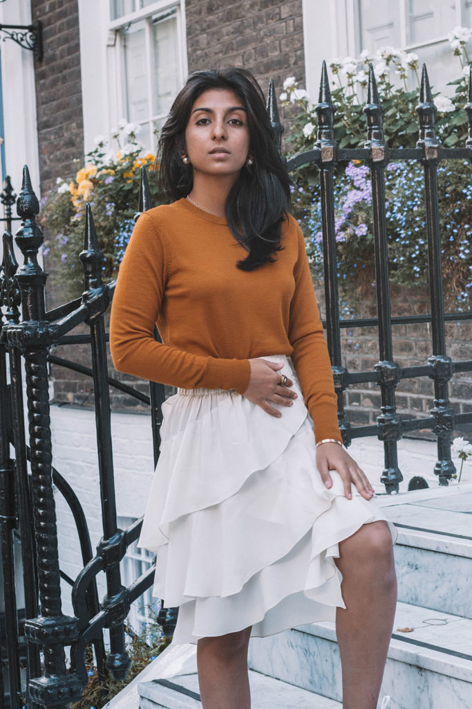 Fashion blogger Shloka Narang of the Silk Sneakers create a stunning fall outfit transitioning the summer skirt in autumn with Isabel Marant Etoile, Uniqlo and Amazon Find