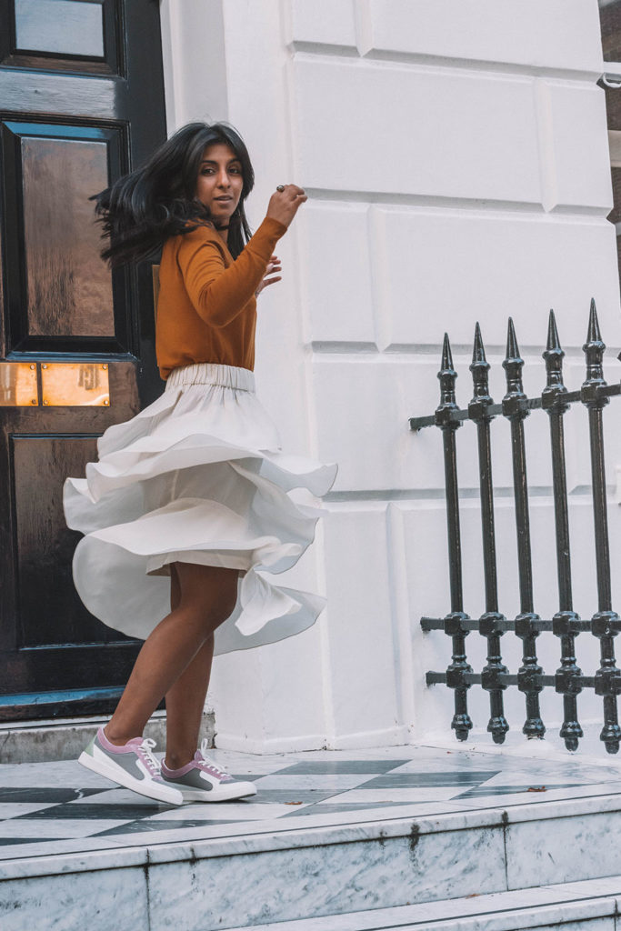 Fashion blogger Shloka Narang of The Silk Sneaker creates a stunning autumn outfit transitioning the summer skirt into autumn with Isabel Marant, Uniqlo and Amazon Find