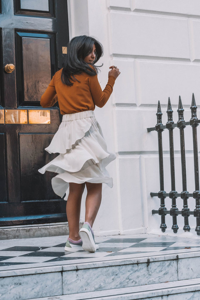 Fashion blogger Shloka Narang of The Silk Sneaker creates a stunning autumn outfit transitioning the summer skirt into autumn with Isabel Marant, Uniqlo and Amazon Find