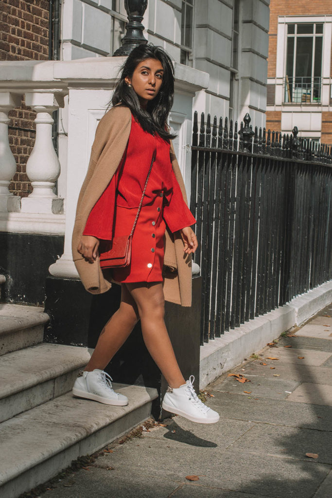 Fashion Blogger Shloka Narang of The Silk Sneaker creates a fabulous red outfit showing you how to wear monochrome outfits this fall