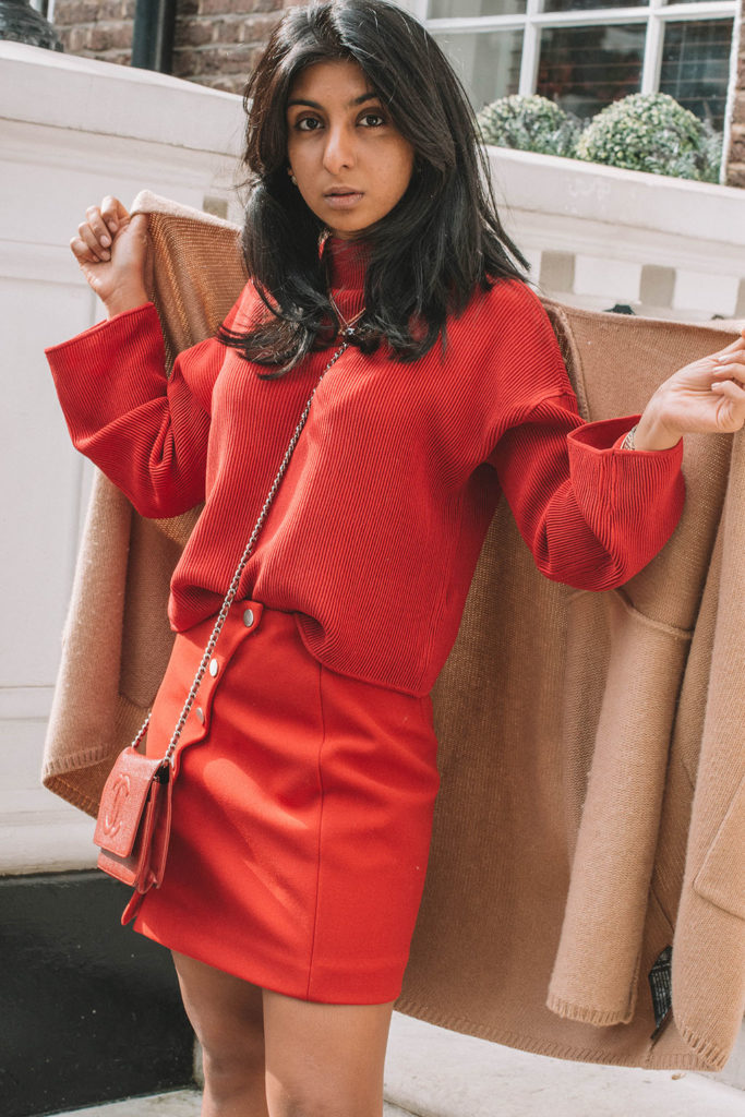 Fashion Blogger Shloka Narang of The Silk Sneaker creates a fabulous red outfit showing you how to wear monochrome outfits this fall