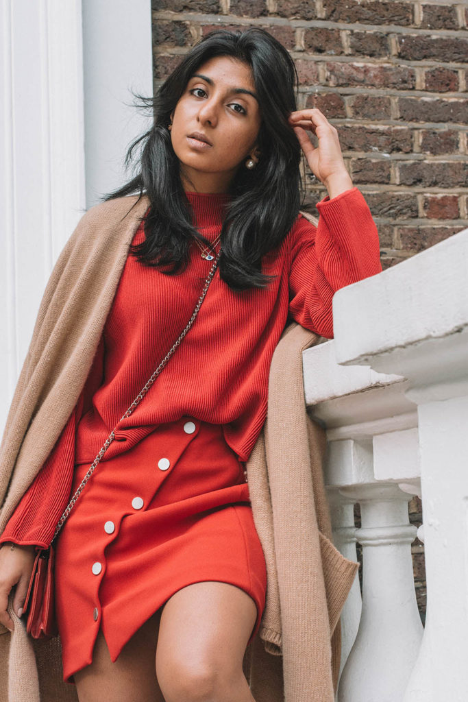Fashion Blogger Shloka Narang of The Silk Sneaker creates a fabulous red outfit showing you how to wear monochrome outfits this fall