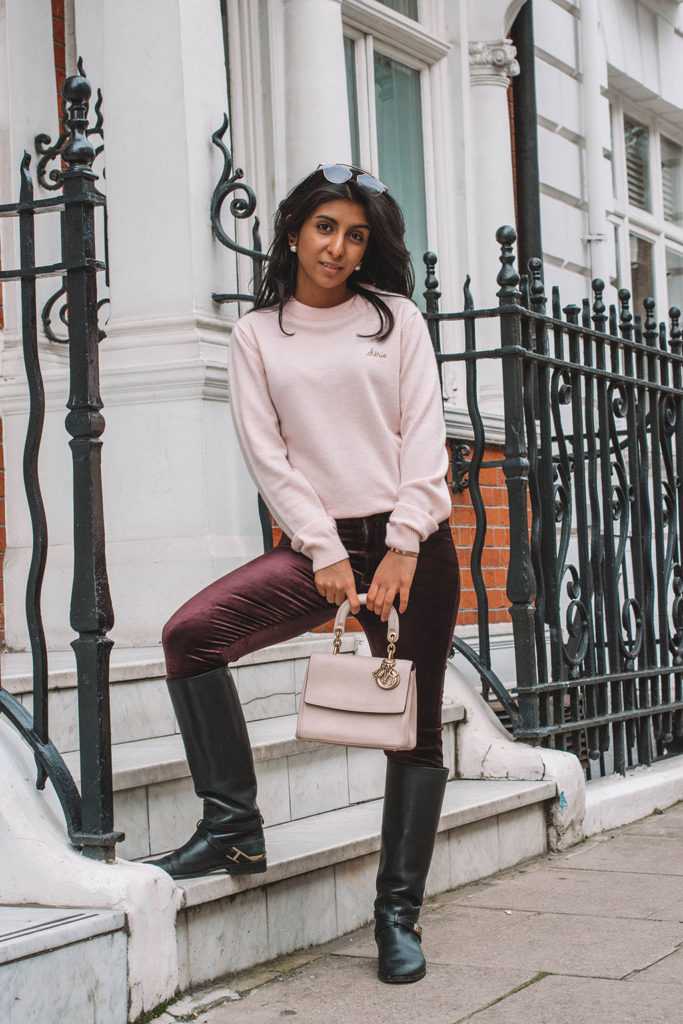 Fashion blogger Shloka Narang of The Silk Sneaker showcases how to style velvet pants in a winter outfit with Paige and Dior