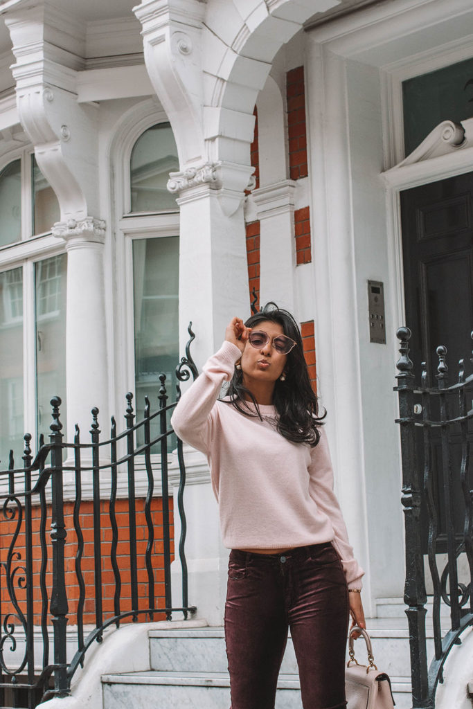 Fashion blogger Shloka Narang of The Silk Sneaker showcases how to style velvet pants in a winter outfit with Paige and Dior