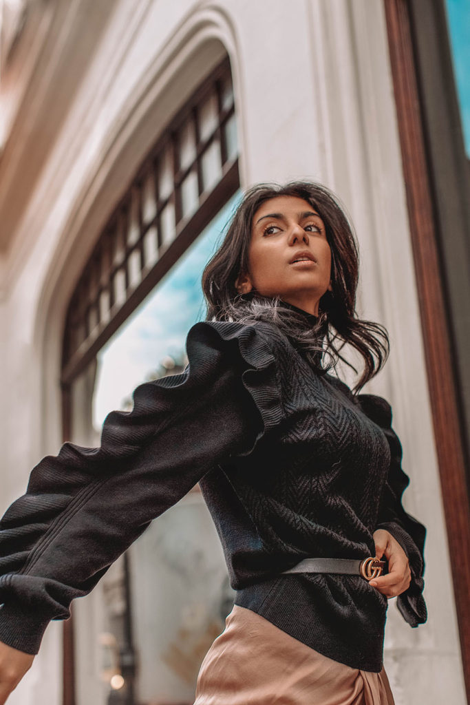 Fashion blogger Shloka Narang of The Silk Sneaker showcases how to wear a summer skirt in winter