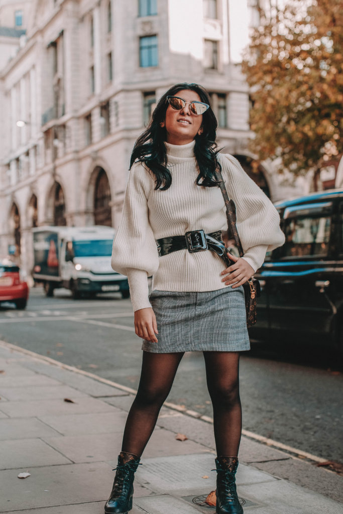 Fashion blogger Shloka Narang of The Silk Sneaker shares the must have sweater for 2018 in this sweater outfit idea