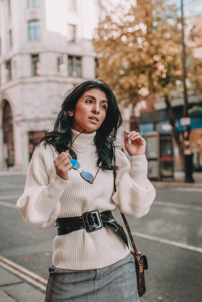 Fashion blogger Shloka Narang of The Silk Sneaker shares the must have sweater for 2018 in this sweater outfit idea