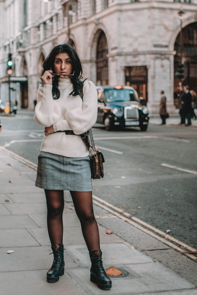 Fashion blogger Shloka Narang of The Silk Sneaker shares the must have sweater for 2018 in this sweater outfit idea