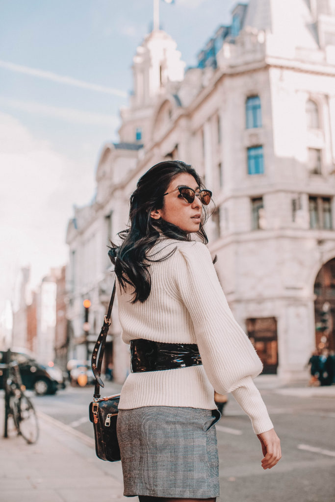Fashion blogger Shloka Narang of The Silk Sneaker shares the must have sweater for 2018 in this sweater outfit idea