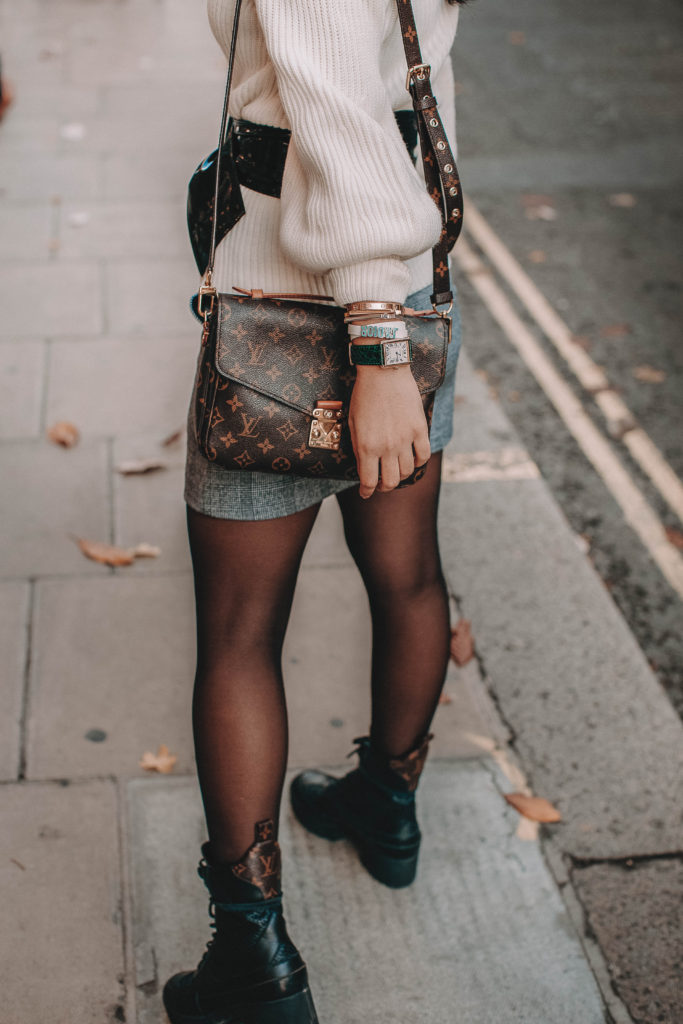 Fashion blogger Shloka Narang of The Silk Sneaker shares the must have sweater for 2018 in this sweater outfit idea