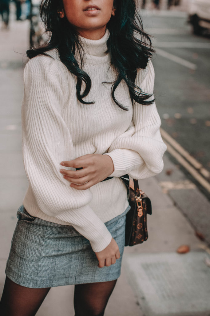 Fashion blogger Shloka Narang of The Silk Sneaker shares the must have sweater for 2018 in this sweater outfit idea