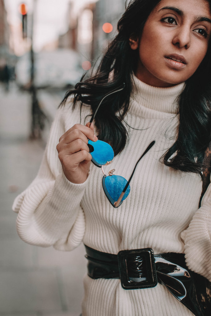 Fashion blogger Shloka Narang of The Silk Sneaker shares the must have sweater for 2018 in this sweater outfit idea