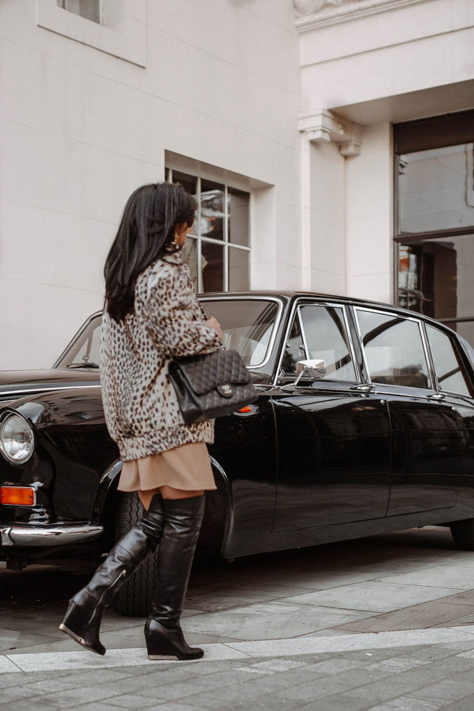 Fashion blogger Shloka Narang of The Silk Sneaker shares how to style a leopard print coat featuring By Malene Birger, Maje and Chanel