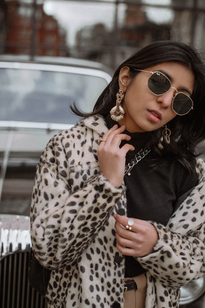 Fashion blogger Shloka Narang of The Silk Sneaker shares how to style a leopard print coat featuring By Malene Birger, Maje and Chanel