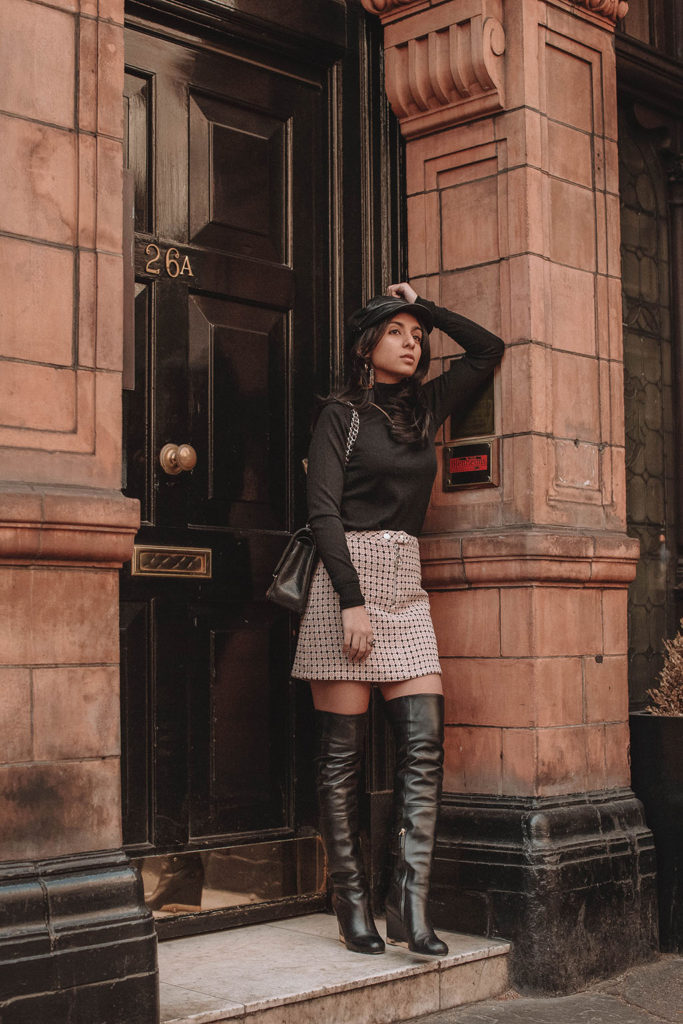 Fashion blogger Shloka Narang of The Silk Sneaker showcases a spring outfit idea with a tweed skirt from Topshop