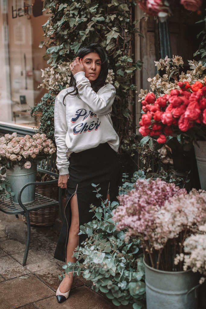 Fashion blogger Shloka Narang of The Silk Sneaker shares a style trick for how to style a statement sweater for a cozy and cute spring summer outfit featuring Ba&sh and Chanel