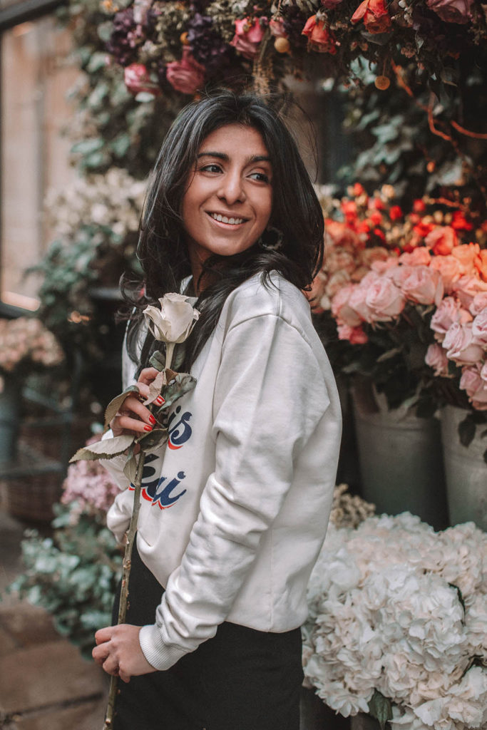 Fashion blogger Shloka Narang of The Silk Sneaker shares a style trick for how to style a statement sweater for a cozy and cute spring summer outfit featuring Ba&sh and Chanel