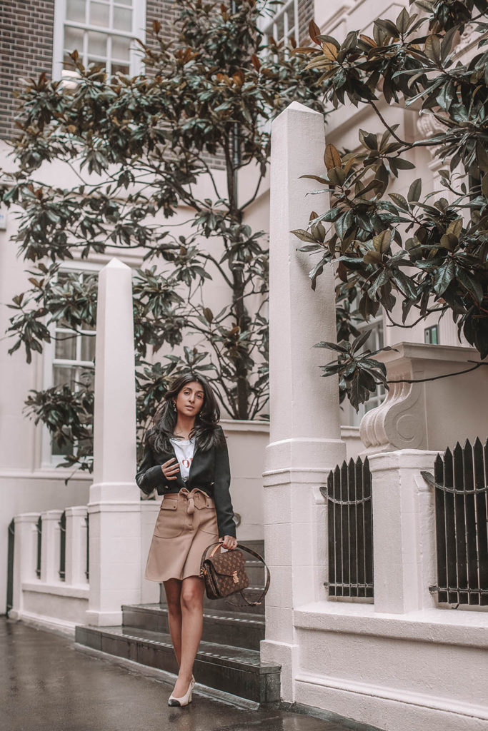 Fashion blogger Shloka Narang of The Silk Sneaker shares her style trick in how to style a blazer for a casual spring outfit idea featuring River Island, Maje, Louis Vuitton and Chanel