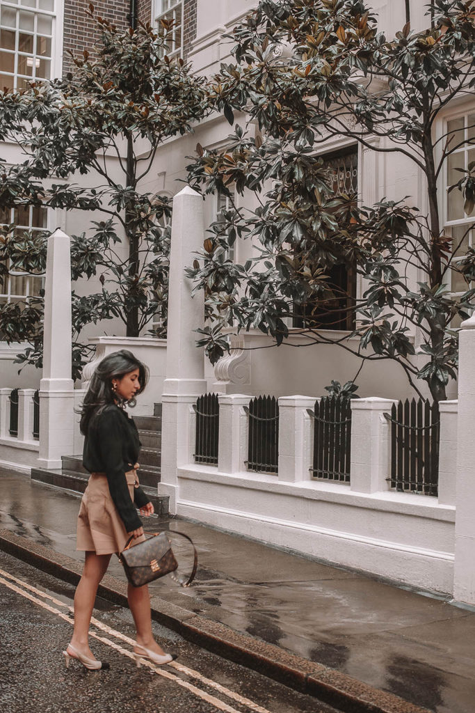 Fashion blogger Shloka Narang of The Silk Sneaker shares her style trick in how to style a blazer for a casual spring outfit idea featuring River Island, Maje, Louis Vuitton and Chanel