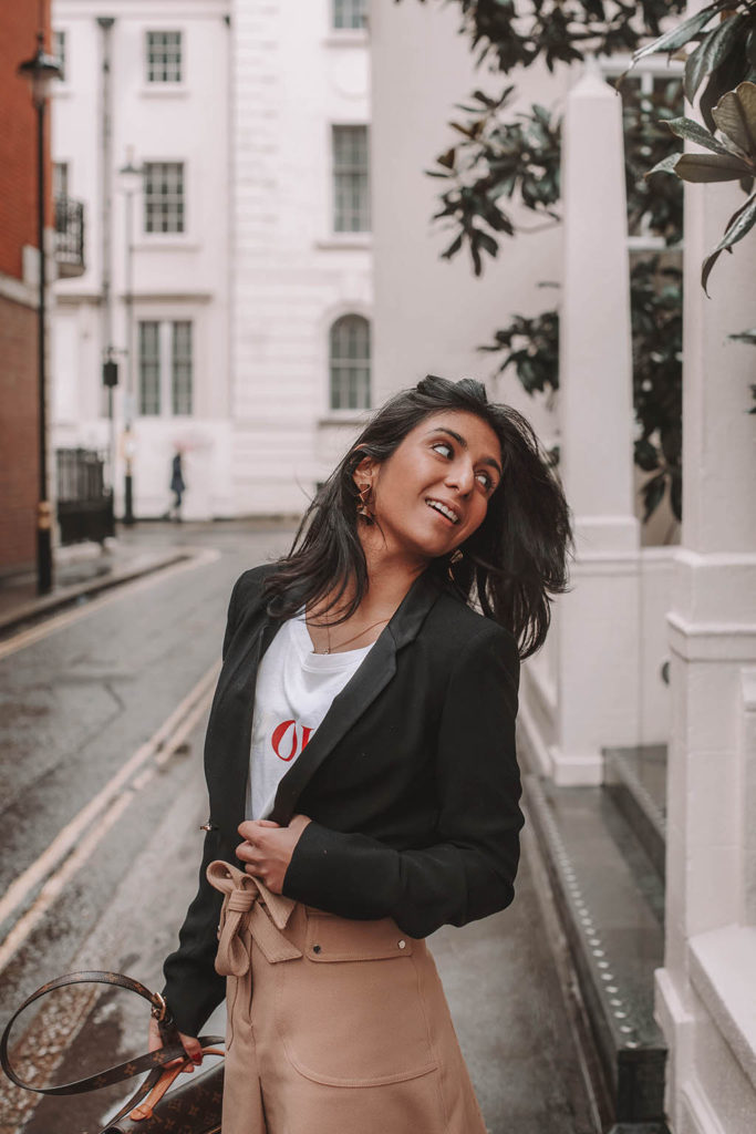 Fashion blogger Shloka Narang of The Silk Sneaker shares her style trick in how to style a blazer for a casual spring outfit idea featuring River Island, Maje, Louis Vuitton and Chanel