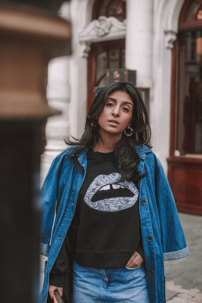 Fashion blogger Shloka Narang of The Silk Sneaker shares how to wear denim on denim for a double denim spring outfit featuring Louis Vuitton and Markus Lupfer