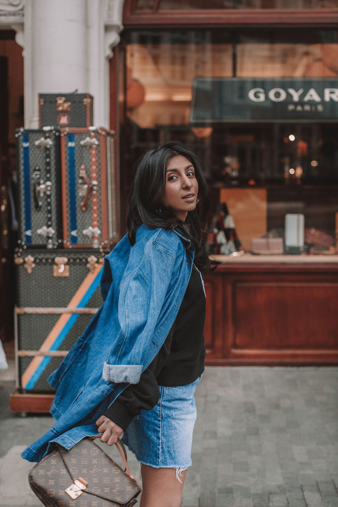 Fashion blogger Shloka Narang of The Silk Sneaker shares how to wear denim on denim for a double denim spring outfit featuring Louis Vuitton and Markus Lupfer