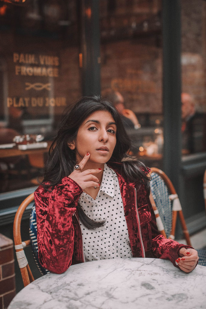 Fashion blogger Shloka Narang of The Silk Sneaker shares a polka dots spring outfit idea for a casual look featuring Topshop Jeans, Fabled polka dots shirt and Chanel shoes.
