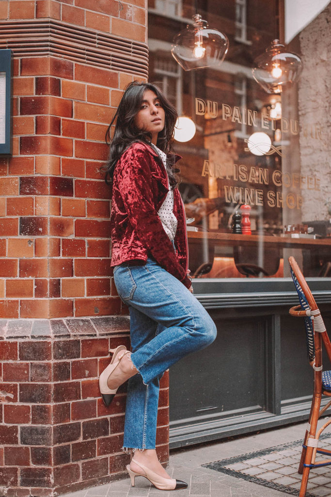 Fashion blogger Shloka Narang of The Silk Sneaker shares a polka dots spring outfit idea for a casual look featuring Topshop Jeans, Fabled polka dots shirt and Chanel shoes.