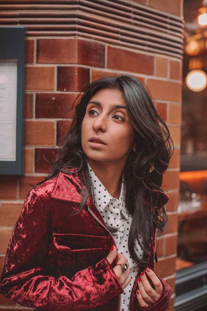 Fashion blogger Shloka Narang of The Silk Sneaker shares a polka dots spring outfit idea for a casual look featuring Topshop Jeans, Fabled polka dots shirt and Chanel shoes.
