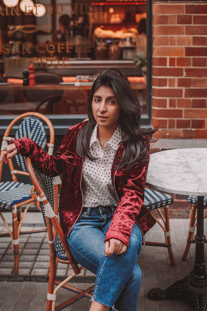 Fashion blogger Shloka Narang of The Silk Sneaker shares a polka dots spring outfit idea for a casual look featuring Topshop Jeans, Fabled polka dots shirt and Chanel shoes.