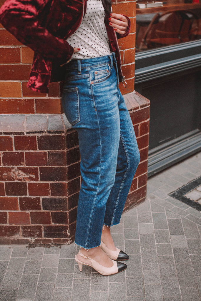 Fashion blogger Shloka Narang of The Silk Sneaker shares a polka dots spring outfit idea for a casual look featuring Topshop Jeans, Fabled polka dots shirt and Chanel shoes.