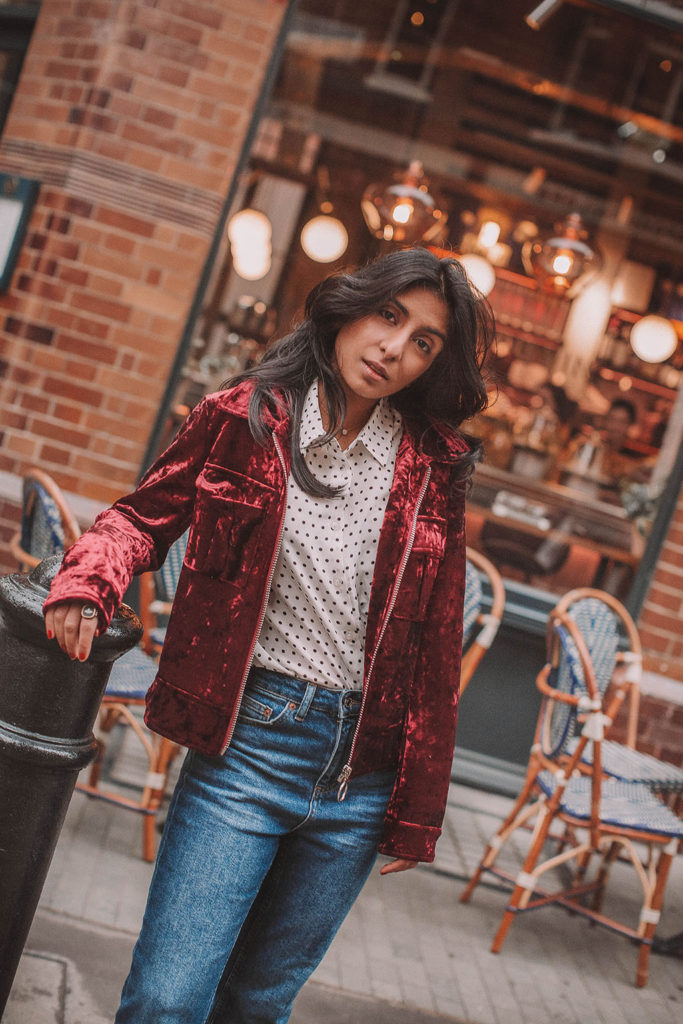 Fashion blogger Shloka Narang of The Silk Sneaker shares a polka dots spring outfit idea for a casual look featuring Topshop Jeans, Fabled polka dots shirt and Chanel shoes.