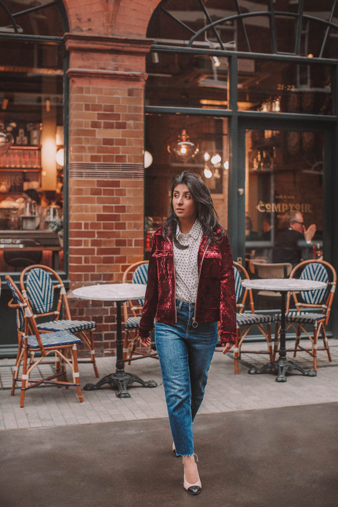 Fashion blogger Shloka Narang of The Silk Sneaker shares a polka dots spring outfit idea for a casual look featuring Topshop Jeans, Fabled polka dots shirt and Chanel shoes.