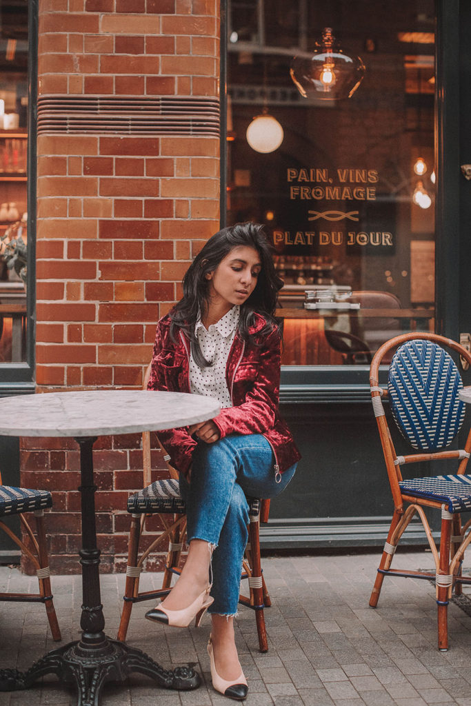 Fashion blogger Shloka Narang of The Silk Sneaker shares a polka dots spring outfit idea for a casual look featuring Topshop Jeans, Fabled polka dots shirt and Chanel shoes.