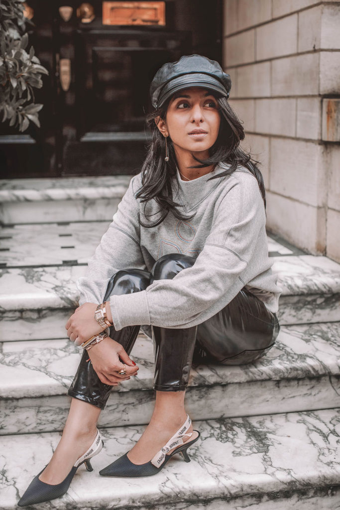 Fashion blogger Shloka Narang of The Silk Sneaker shares how to style a vinyl trousers outfit for the perfect spring outfit idea featuring Isabel Marant Etoile, Dior and Topshop