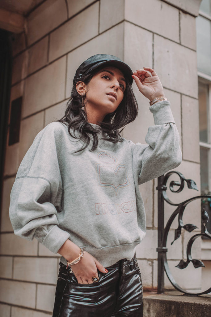 Fashion blogger Shloka Narang of The Silk Sneaker shares how to style a vinyl trousers outfit for the perfect spring outfit idea featuring Isabel Marant Etoile, Dior and Topshop