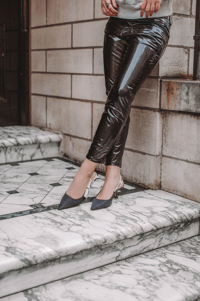Fashion blogger Shloka Narang of The Silk Sneaker shares how to style a vinyl trousers outfit for the perfect spring outfit idea featuring Isabel Marant Etoile, Dior and Topshop