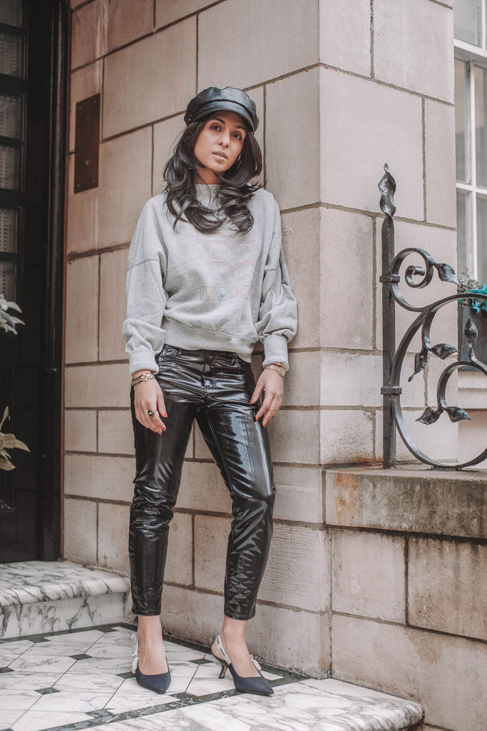 Fashion blogger Shloka Narang of The Silk Sneaker shares how to style a vinyl trousers outfit for the perfect spring outfit idea featuring Isabel Marant Etoile, Dior and Topshop