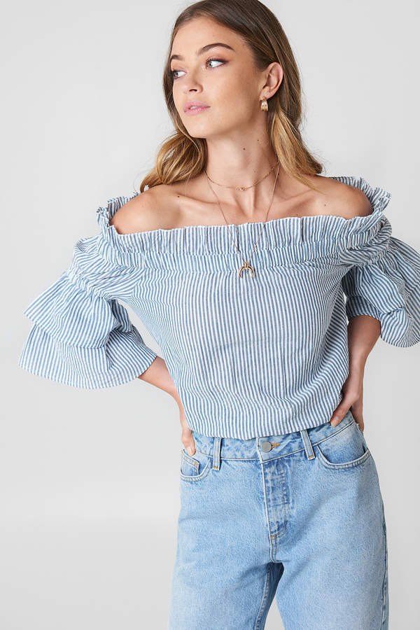 Fashion blogger Shloka Narang from The Silk Sneaker shares her five favourite summer blouses under £50 including ASOS, Topshop and more