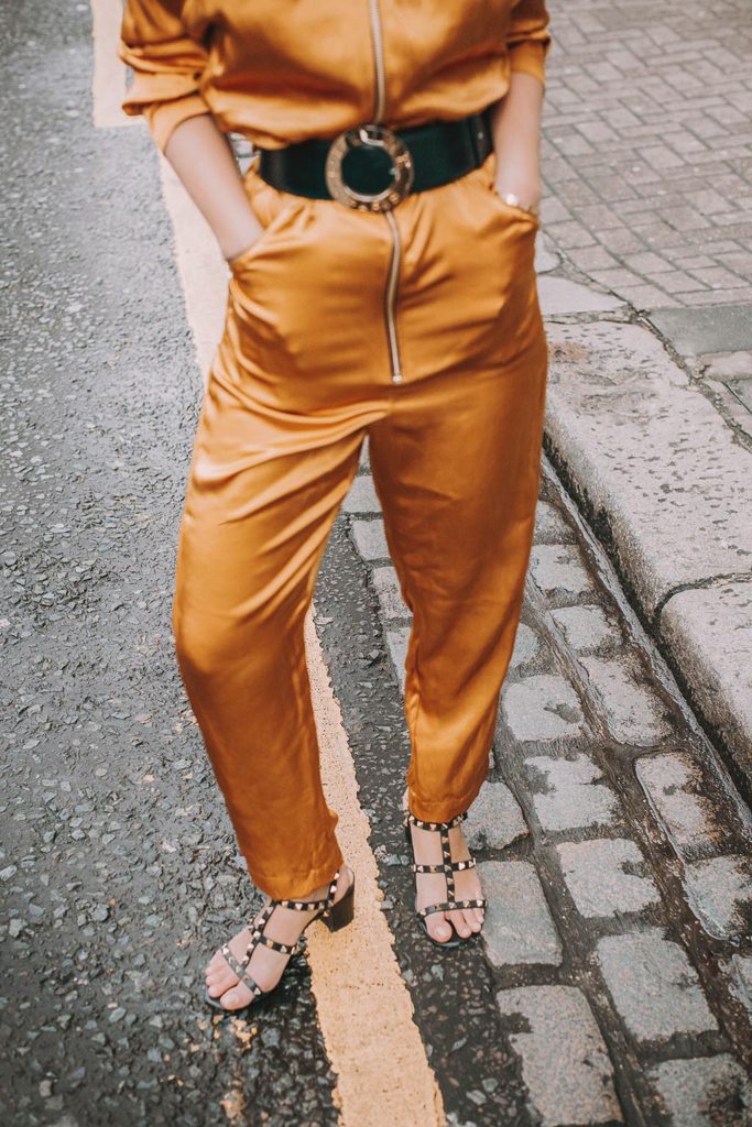 Fashion blogger Shloka Narang of The Silk Sneaker shares how to wear a jumpsuit for a casual summer outfit featuring Celine and Valentino.