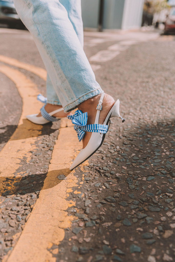 Fashion blogger SHloka Narang of The Silk Sneaker shares how to create the perfect double denim outfit for summer outfit inspiration featuring Topshop Denim and Prada