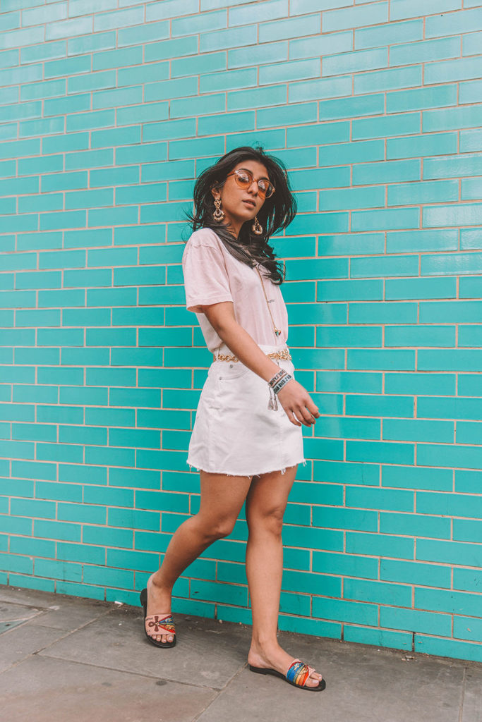 Fashion blogger Shoka Narang of The Silk Sneaker shares her secret to investing in luxury t shirts while comparing the Gucci t shirt and the Saint Laurent t shirt in a casual summer outfit featuring Saint Laurent, Dior and Topshop