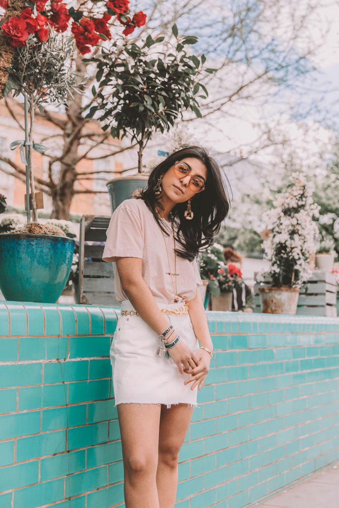 Fashion blogger Shoka Narang of The Silk Sneaker shares her secret to investing in luxury t shirts while comparing the Gucci t shirt and the Saint Laurent t shirt in a casual summer outfit featuring Saint Laurent, Dior and Topshop