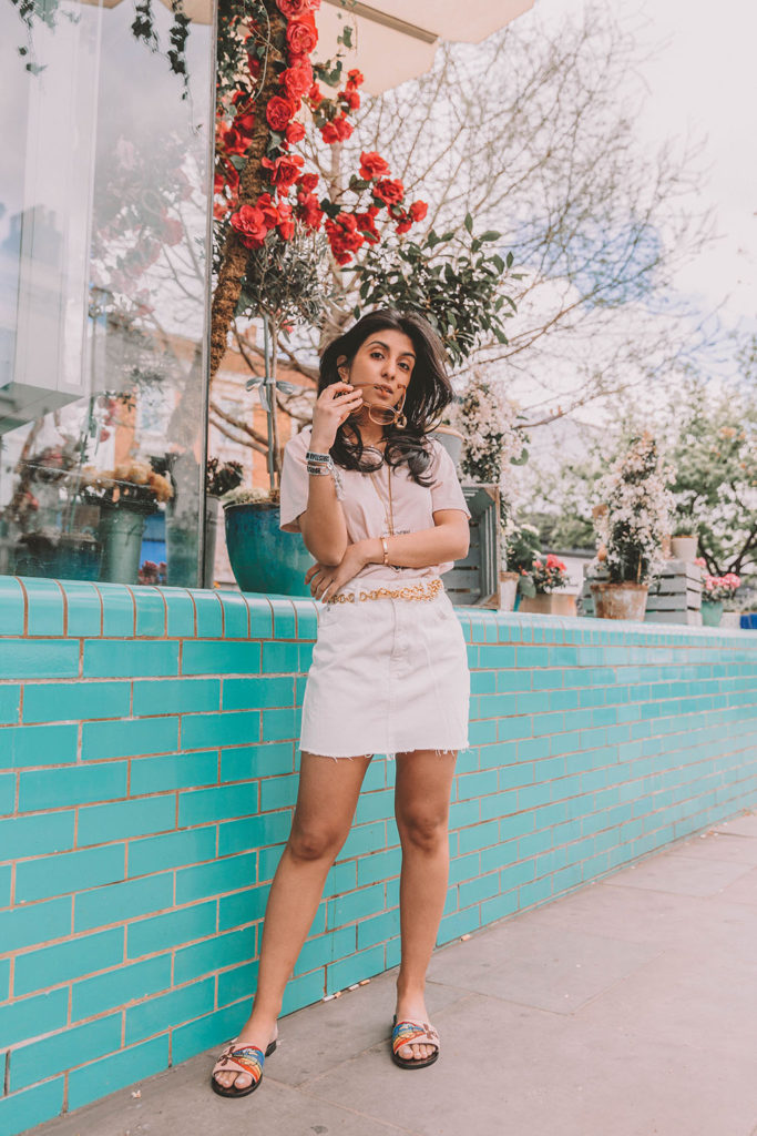 Fashion blogger Shoka Narang of The Silk Sneaker shares her secret to investing in luxury t shirts while comparing the Gucci t shirt and the Saint Laurent t shirt in a casual summer outfit featuring Saint Laurent, Dior and Topshop