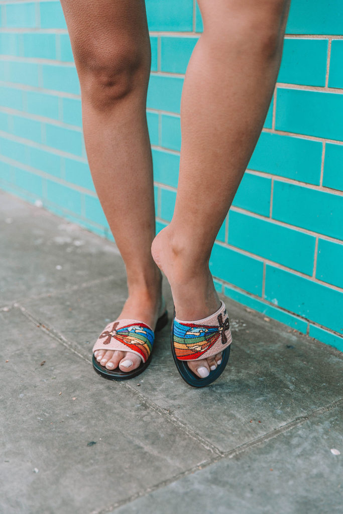 Fashion blogger Shoka Narang of The Silk Sneaker shares her secret to investing in luxury t shirts while comparing the Gucci t shirt and the Saint Laurent t shirt in a casual summer outfit featuring Saint Laurent, Dior and Topshop