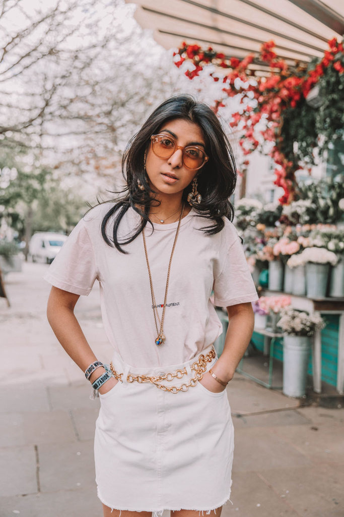 Fashion blogger Shoka Narang of The Silk Sneaker shares her secret to investing in luxury t shirts while comparing the Gucci t shirt and the Saint Laurent t shirt in a casual summer outfit featuring Saint Laurent, Dior and Topshop