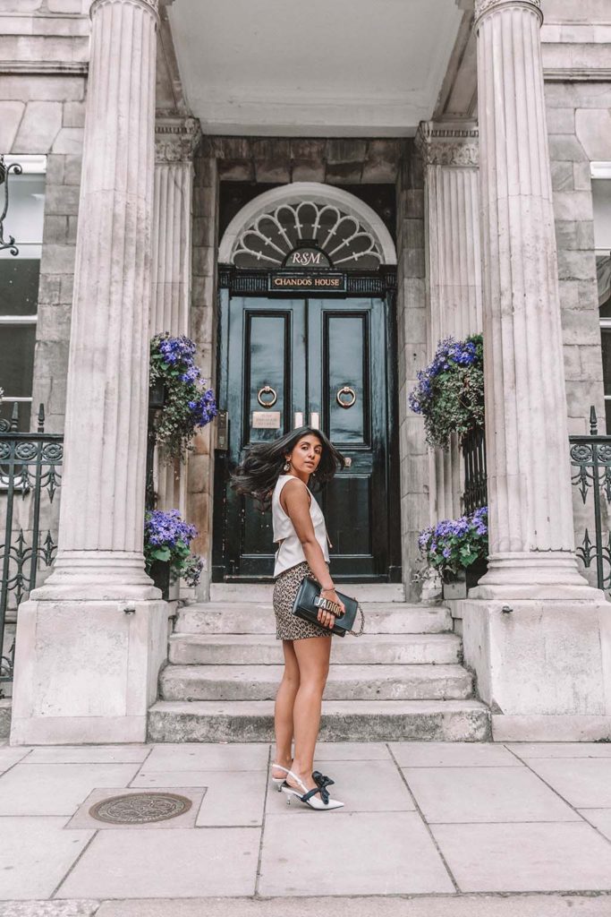 Fashion blogger Shloka Narang of The Silk Sneaker shares why you need a leopard print mini skirt in your wardrobe to create the perfect summer outfit featuring Topshop, Prada and Dior