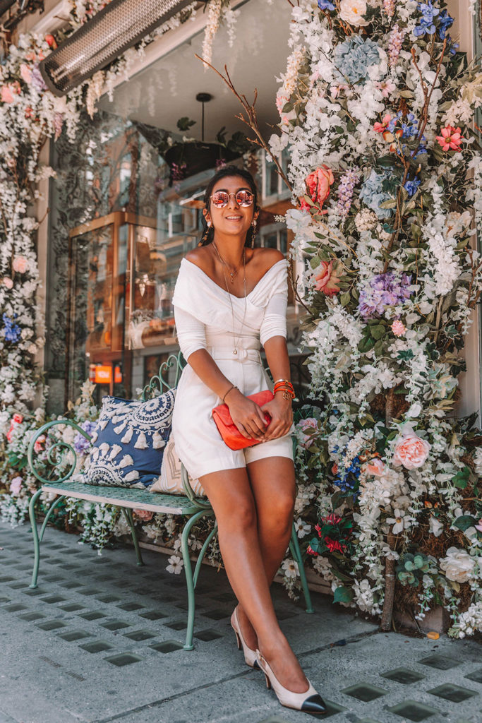 Fashion blogger Shloka Narang of The Silk Sneaker shares tips on how to wear a white monochrome summer outfit featuring Storets, Mango and Chanel
