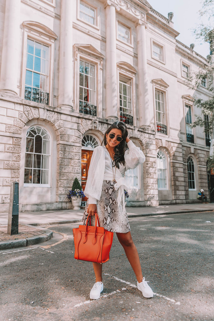 Fashion blogger Shloka Narang of The Silk Sneaker shares the summer blouse you need to create a cute summer outfit featuring ba&sh, Celine and Ray-Ban