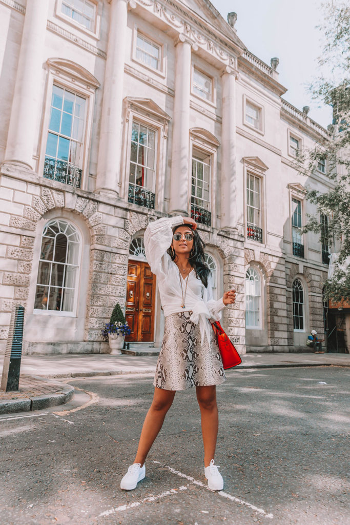 Fashion blogger Shloka Narang of The Silk Sneaker shares the summer blouse you need to create a cute summer outfit featuring ba&sh, Celine and Ray-Ban
